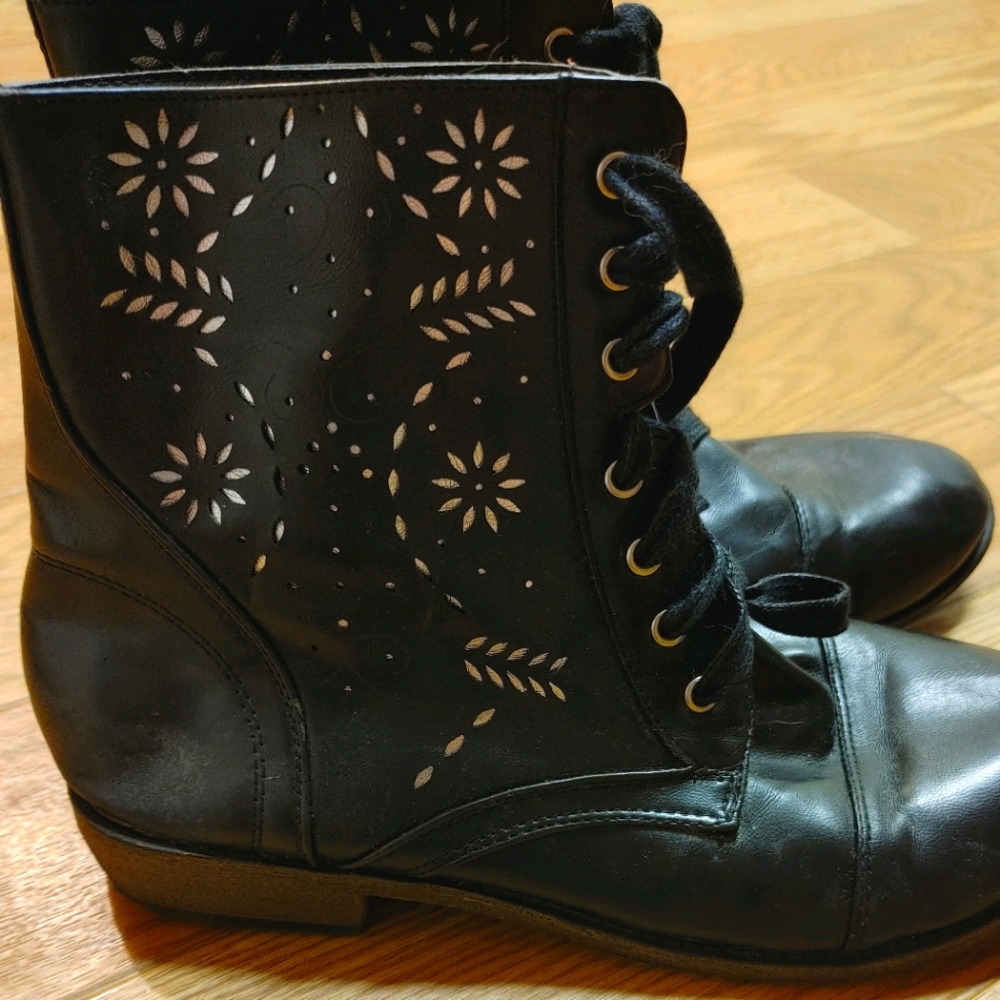 Black lace up boots with silver detailing
